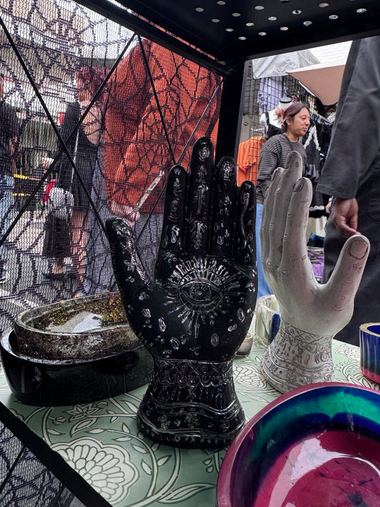 Hand-finished black palmistry hand decor with metallic detailing by Morrigu Star