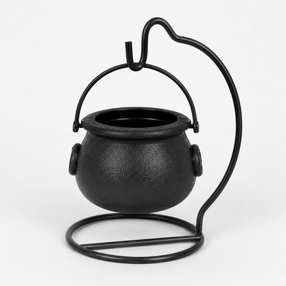 Black cauldron-shaped metal candle holder with a textured finish, featuring a curved support stand and a top hanging loop, shown on a plain white background.