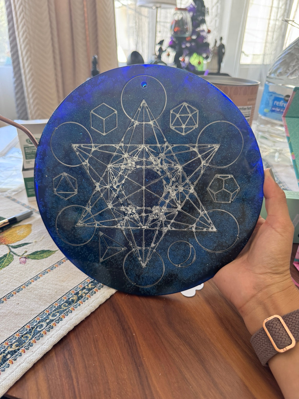 Finished handmade Metatron’s Cube resin altar piece showing silver hand-painted sacred geometry on a deep blue celestial background