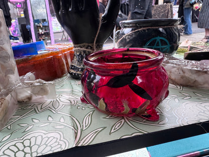 Close view of removable skull and bone lid on translucent crimson mini cauldron