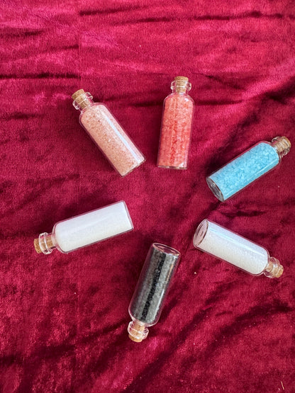 Six Morrigu Star ritual salt bottles arranged in a circle